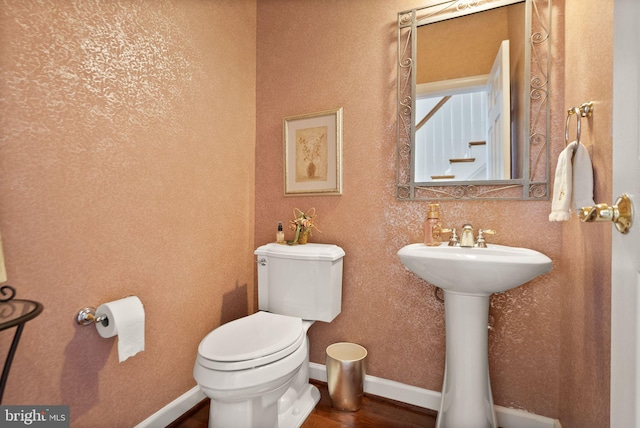 43005 Running Ridge Way, Leesburg, VA 20176 - half bath featuring toilet, baseboards, and wood finished floors