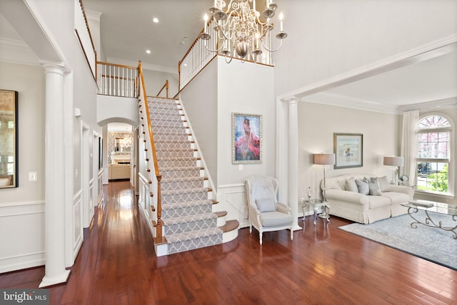 43005 Running Ridge Way, Leesburg, VA 20176 - entryway with stairway, ornamental molding, dark wood-type flooring, ornate columns, and arched walkways