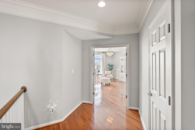 43005 Running Ridge Way, Leesburg, VA 20176 - hallway featuring light wood-style floors, baseboards, crown molding, an upstairs landing, and recessed lighting
