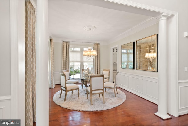 43005 Running Ridge Way, Leesburg, VA 20176 - dining room featuring crown molding, a decorative wall, a chandelier, wood finished floors, and a wainscoted wall