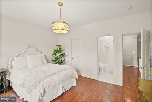 43005 Running Ridge Way, Leesburg, VA 20176 - bedroom with wood finished floors, baseboards, and ensuite bath