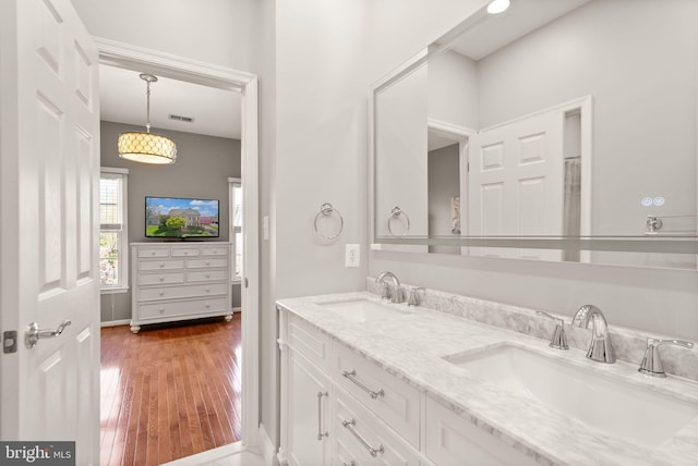 43005 Running Ridge Way, Leesburg, VA 20176 - bathroom featuring double vanity and wood-type flooring