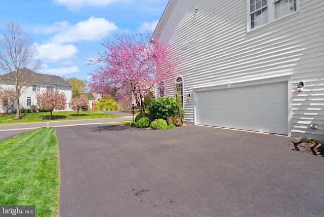 43005 Running Ridge Way, Leesburg, VA 20176 - view of home's exterior with an attached garage and asphalt driveway