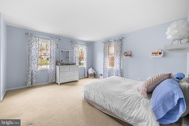 carpeted bedroom with baseboards