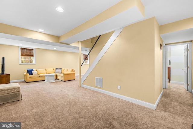 carpeted living room featuring recessed lighting, visible vents, and baseboards