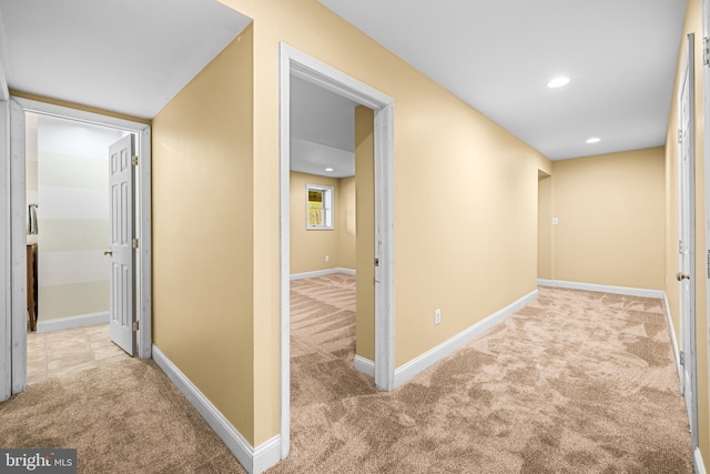 hall with baseboards, carpet, and recessed lighting