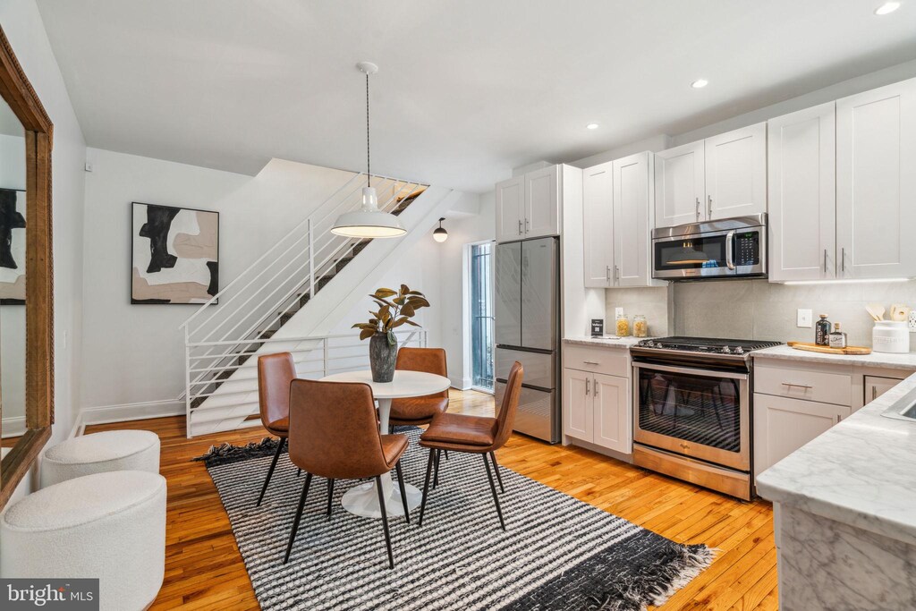 607 S 20th St, Philadelphia, PA 19146 - kitchen featuring light wood-style flooring, recessed lighting, and appliances with stainless steel finishes