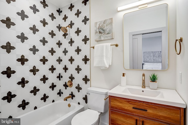 full bathroom featuring washtub / shower combination, vanity, and toilet
