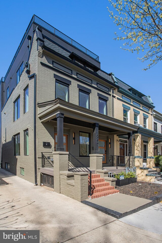 1023 Irving St NW, Washington, DC 20010 - multi unit property featuring brick siding and covered porch