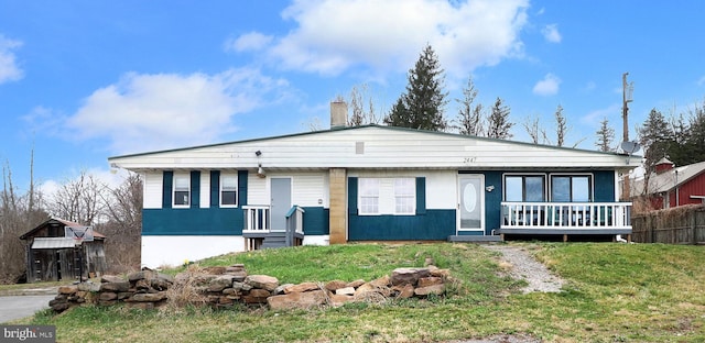 2447 General Potter Hwy, Centre Hall, PA 16828 - ranch-style home featuring a chimney, a front yard, covered porch, and fence