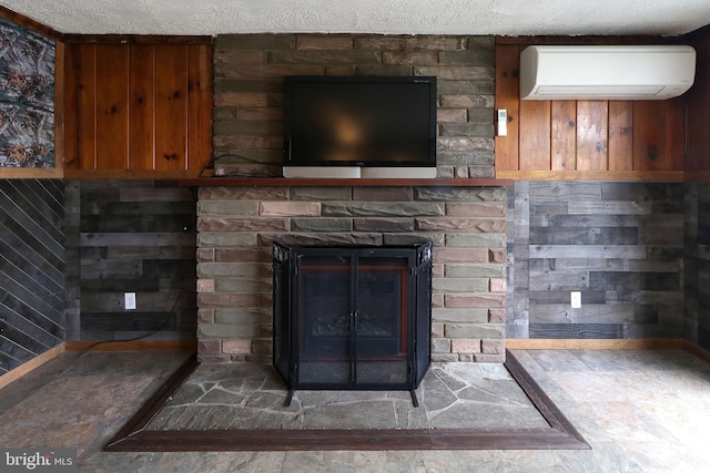2447 General Potter Hwy, Centre Hall, PA 16828 - room details featuring a stone fireplace, an AC wall unit, and a textured ceiling