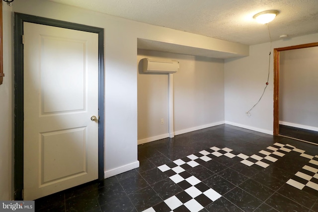 2447 General Potter Hwy, Centre Hall, PA 16828 - finished basement featuring a wall mounted air conditioner, a textured ceiling, baseboards, and dark floors