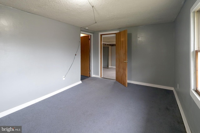 2447 General Potter Hwy, Centre Hall, PA 16828 - empty room with baseboards, carpet, and a textured ceiling