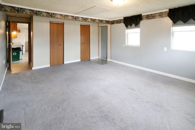 2447 General Potter Hwy, Centre Hall, PA 16828 - unfurnished bedroom featuring baseboards, multiple closets, carpet flooring, and a textured ceiling