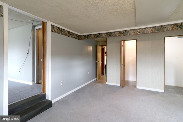 2447 General Potter Hwy, Centre Hall, PA 16828 - unfurnished bedroom featuring baseboards, carpet, and a textured ceiling