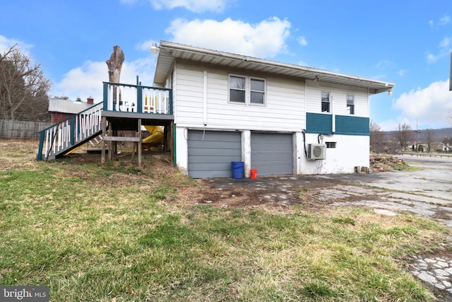 2447 General Potter Hwy, Centre Hall, PA 16828 - rear view of property featuring a wooden deck, driveway, stairway, and an attached garage
