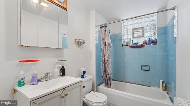 full bathroom featuring shower / bath combo, toilet, radiator, and vanity