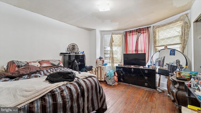 bedroom with hardwood / wood-style floors