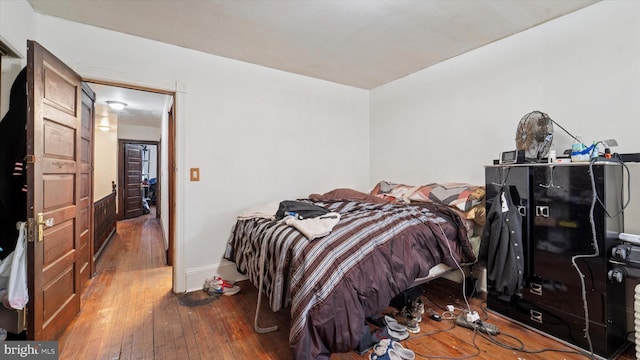 bedroom with hardwood / wood-style flooring