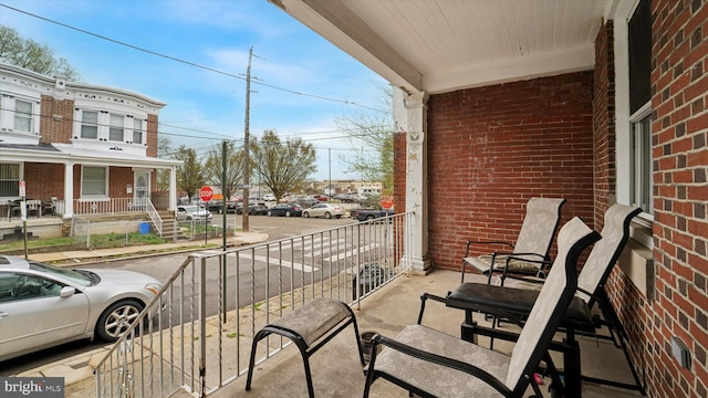 balcony featuring a porch