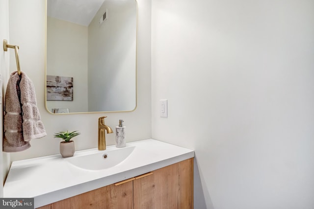bathroom with vanity and visible vents