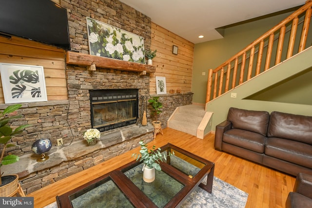 1419 Sandy Shores Rd, Mc Henry, MD 21541 - living room featuring wood walls, wood finished floors, recessed lighting, and a stone fireplace