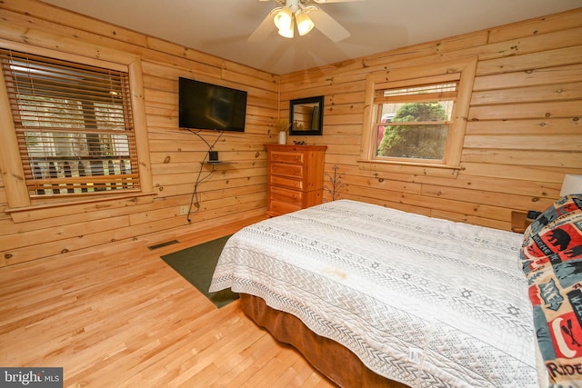 1419 Sandy Shores Rd, Mc Henry, MD 21541 - bedroom with visible vents, wooden walls, and wood finished floors
