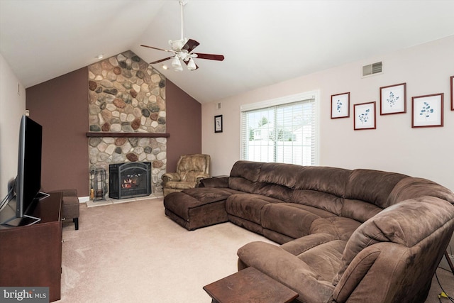 living area featuring visible vents, carpet, lofted ceiling, a ceiling fan, and a fireplace