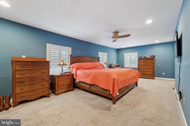 carpeted bedroom featuring baseboards, ceiling fan, and recessed lighting