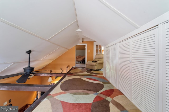 interior space featuring carpet floors and lofted ceiling