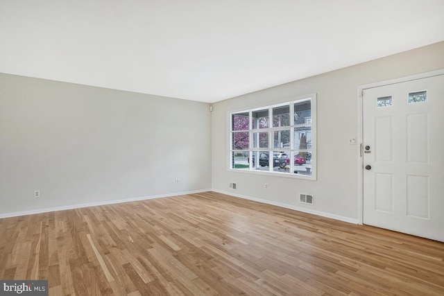 interior space featuring visible vents, baseboards, and light wood-type flooring