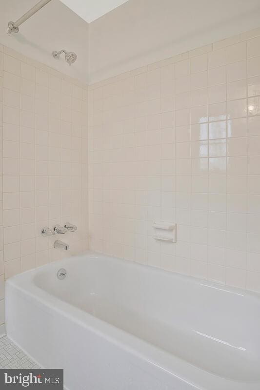 full bathroom featuring tile patterned floors and  shower combination