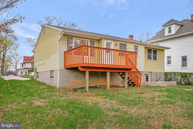 back of house with a yard, stairway, and a wooden deck