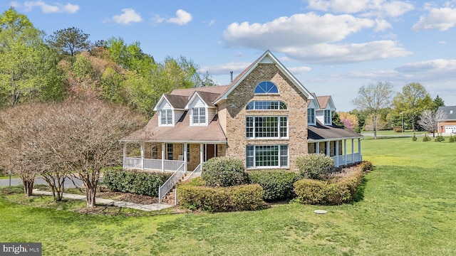 14039 Kreutler Rd, Montpelier, VA 23192 - view of front of house with covered porch, stairway, a front lawn, brick siding, and a shingled roof