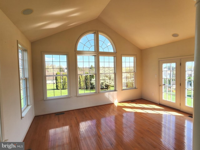 interior space with hardwood / wood-style floors, visible vents, and plenty of natural light