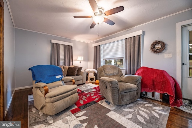 living room with wood finished floors, ceiling fan, baseboards, and ornamental molding