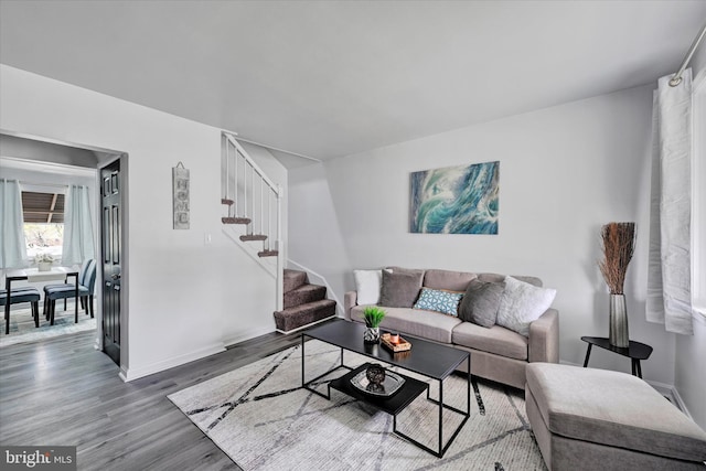 1629 Malvern St, Baltimore, MD 21224 - living room with baseboards, wood finished floors, and stairway