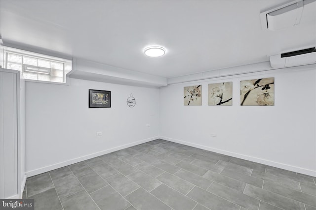 1629 Malvern St, Baltimore, MD 21224 - basement featuring baseboards and a wall mounted AC