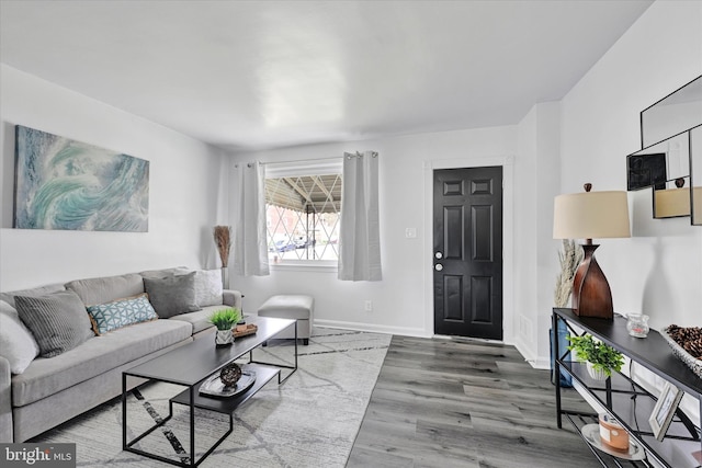 1629 Malvern St, Baltimore, MD 21224 - living area with baseboards and wood finished floors