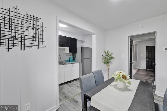 1629 Malvern St, Baltimore, MD 21224 - dining area featuring baseboards and wood finished floors
