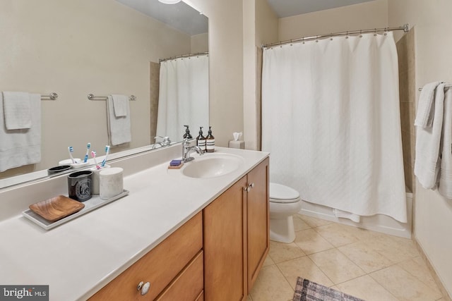 bathroom featuring toilet, vanity, tile patterned floors, and shower / bath combo