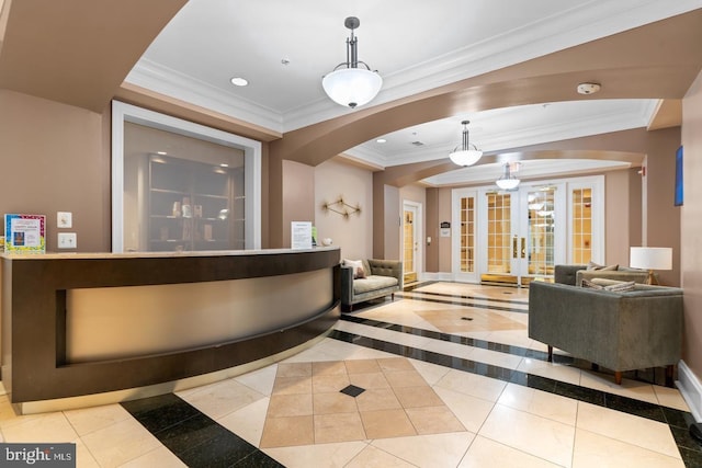 reception with ornamental molding, french doors, recessed lighting, and arched walkways
