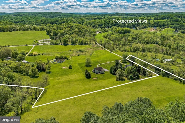 overview of rural landscape featuring property boundaries highlighted and a heavily wooded area