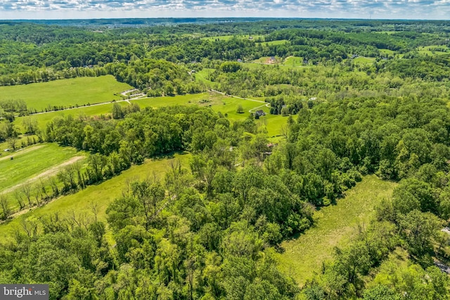 view of rural area featuring a forest