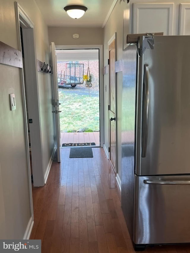 entryway featuring dark wood-style flooring and baseboards