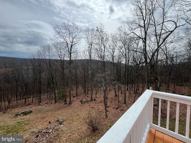 property view of mountains featuring a view of trees