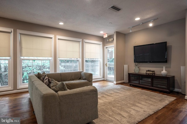 1524 Lincoln Way Unit 409, Mclean, VA 22102 - living area with wood finished floors, a textured ceiling, baseboards, and recessed lighting