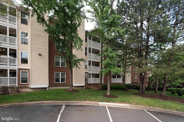 1524 Lincoln Way Unit 409, Mclean, VA 22102 - view of apartment building / complex featuring uncovered parking