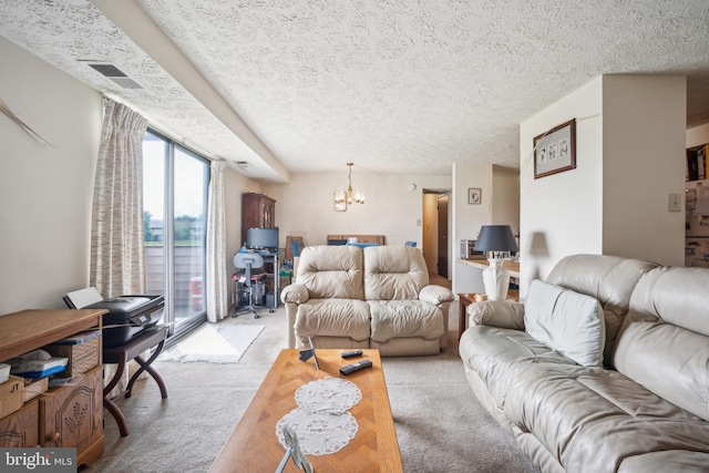 997 Heather Ridge Dr Unit 3G, Frederick, MD 21702 - living area with light colored carpet, a chandelier, and a textured ceiling