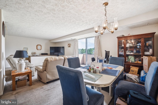 997 Heather Ridge Dr Unit 3G, Frederick, MD 21702 - dining area featuring a chandelier, a textured ceiling, and carpet flooring
